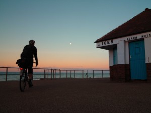 Cycling in Sussex: A dawn ride along the seafront at Bexhill with the setting moon in the western sky Bexhill on Sea East Sussex