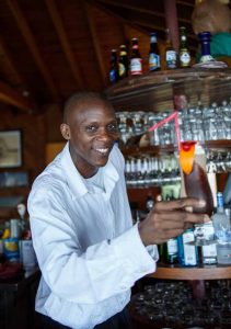 Bartender serves up a rum cocktail at Pussers in Road Town Tortola BVI British Virgin Islands