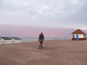 Cycling in Sussex Pink dawn on the seafront at Bexhill on Sea East Sussex
