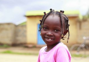 Girl in pin at water kiosk in Nsaivasa Kenya sponsored by Coca-Cola 5by20 Project