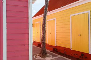 Brightly painted souvenir shacks selling T-shirts and hats and local crafts in Road Town Tortola BVI British Virgin Islands