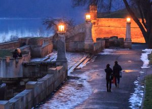 Strollers take in a view over the Danube on a frosty winter's eve