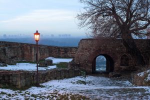 Lamp glows at dusk in Belgrades fortress