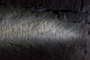 Norse runes inscribed on the walls of Maeshow, a 5000 year old chambered tomb on Mainland, Orkney, Scotland. The Norsemen were part of a raiding party who were caught by a blizzard in 1153 and took shelter in the mysterious tomb