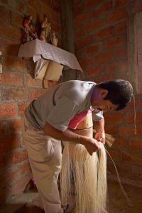 Simón Espinal weaving in his home in Pile, Ecuador He is regarded as the finest living hat weaver, possibly the best ever.