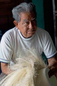 Don Delgado the patriarch of Montecristi hat dealers. He began working in his father's hat shop asa boy in the late 1930s