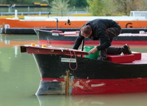 Alban Gibert conducting routine maintenance on the anchor mechanism for the crude oil tanker Brittany before another day on the water. All of the ships have all of the mechanisms that would be used on life-sized ships.
