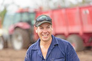 Cane grower with harvester in tropical north Queensland, Australia